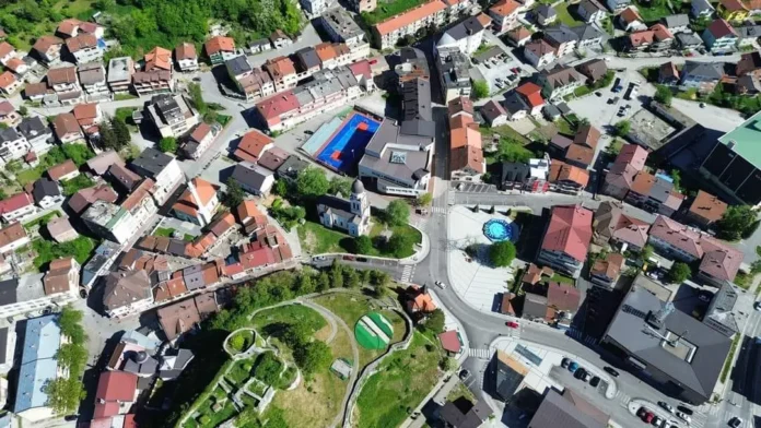 Aerial view of Bosanska Krupa with sports facilities and green spaces.